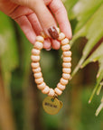 Peach beaded charm bracelet