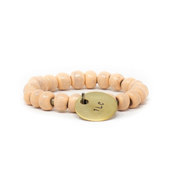 Peach colored beaded charm bracelet