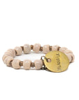Blush pink beaded bracelet with a beautiful charm