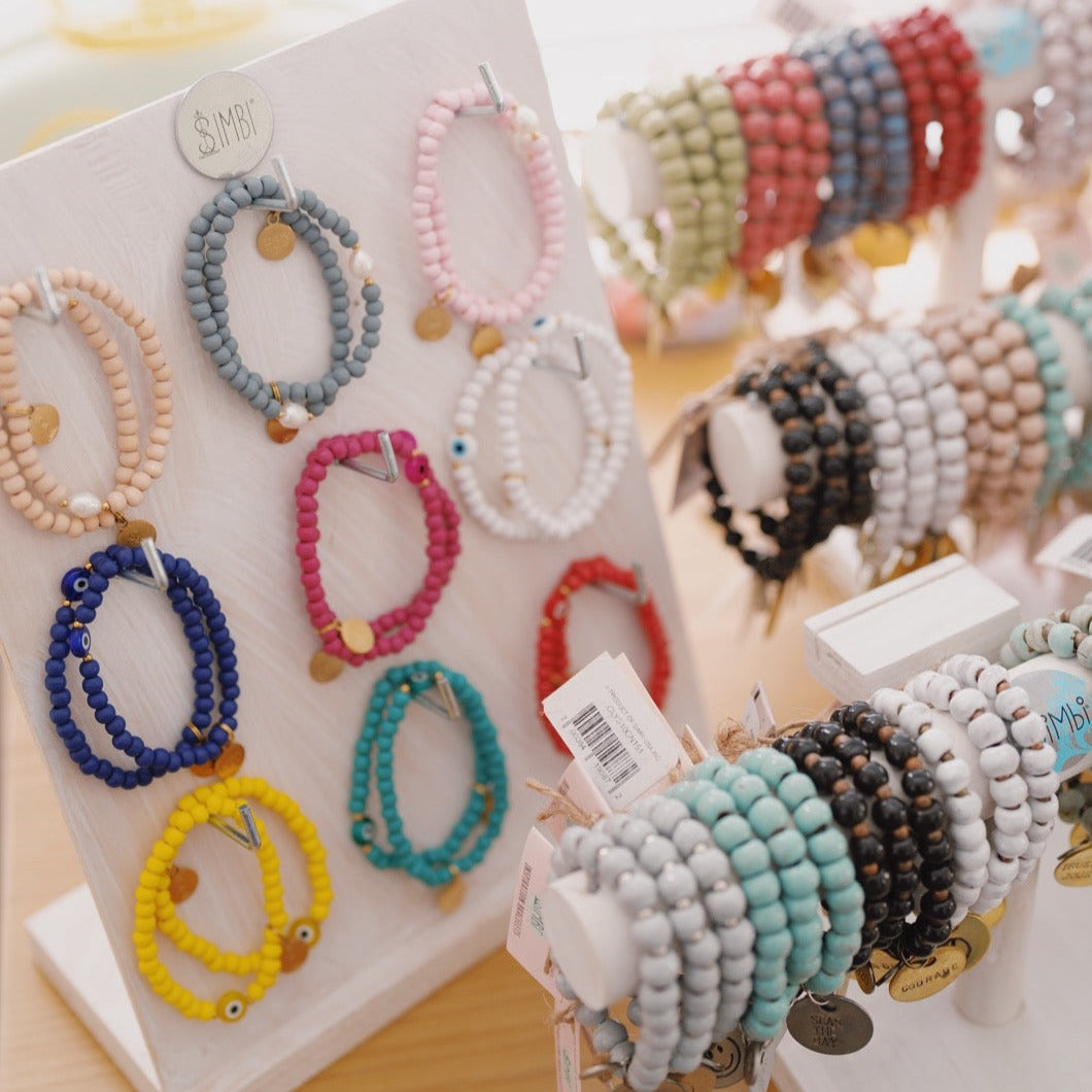Wooden beaded bracelet with evil eye charm