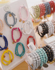 Wooden beaded bracelet with evil eye charm