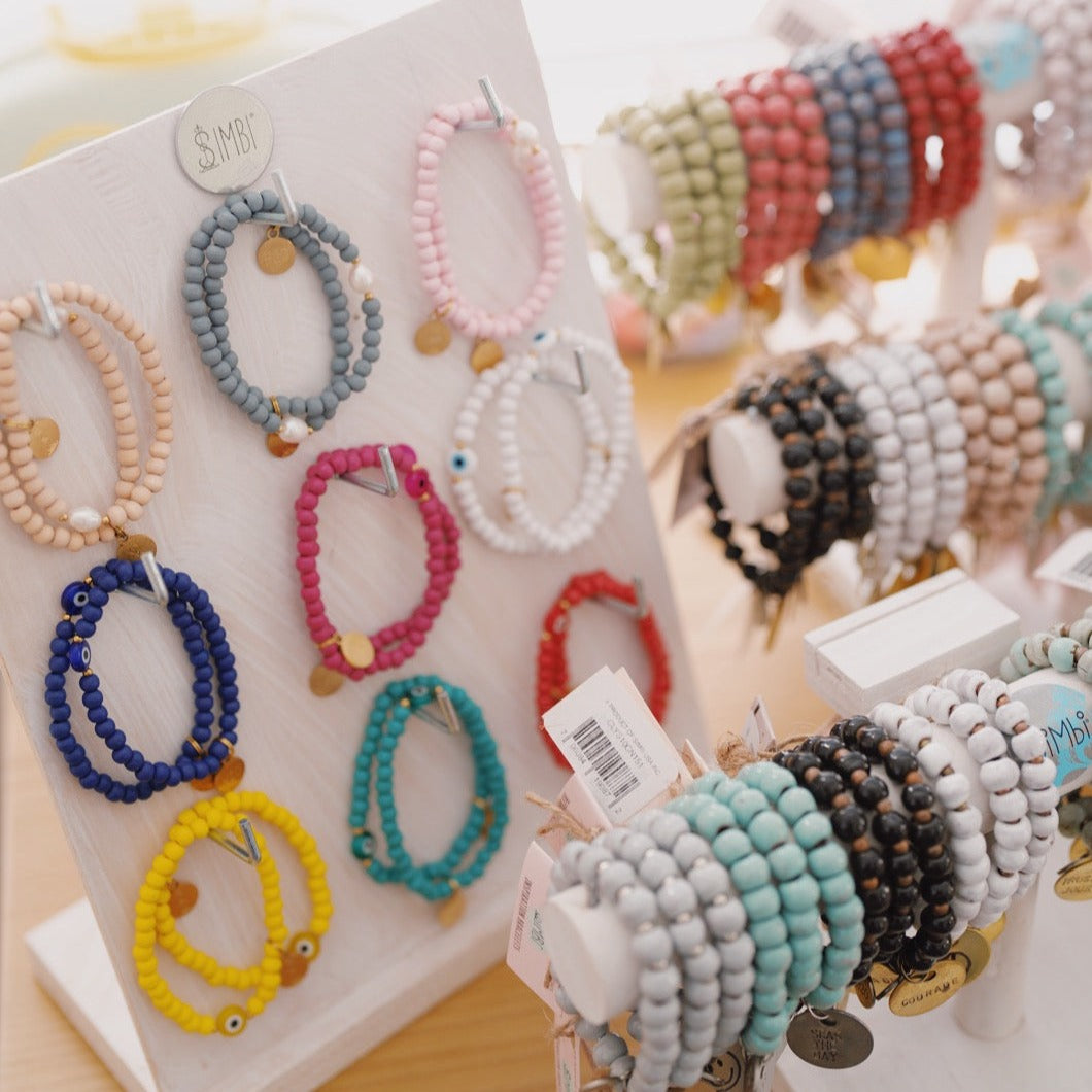 Wooden beaded bracelet with evil eye charm