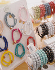 Wooden beaded bracelet with evil eye charm