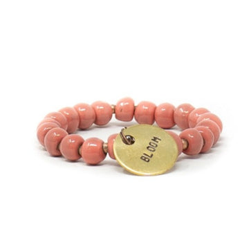 Coral pink message beaten bracelet
