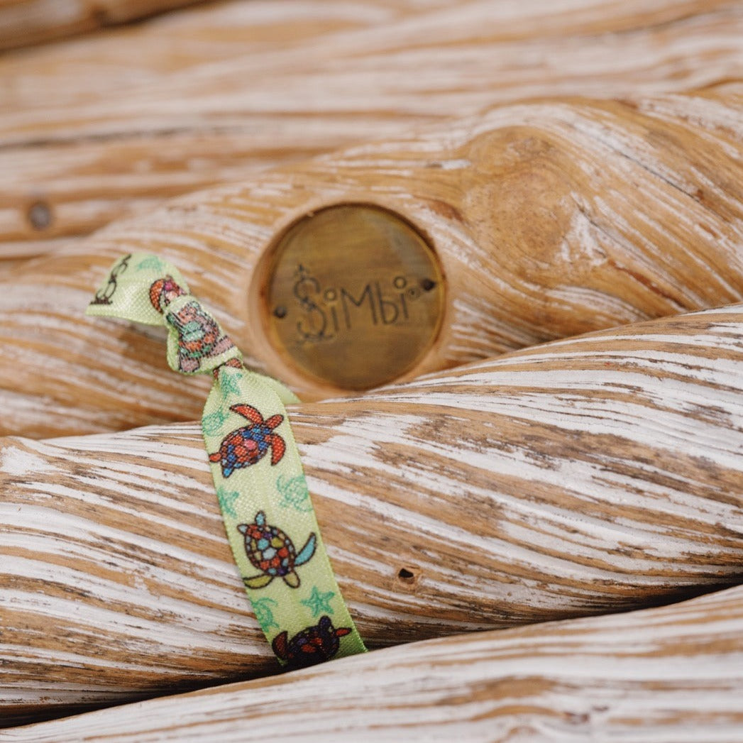 Eco-friendly Simbi hair tie with turtle print. Perfect for nature lovers.