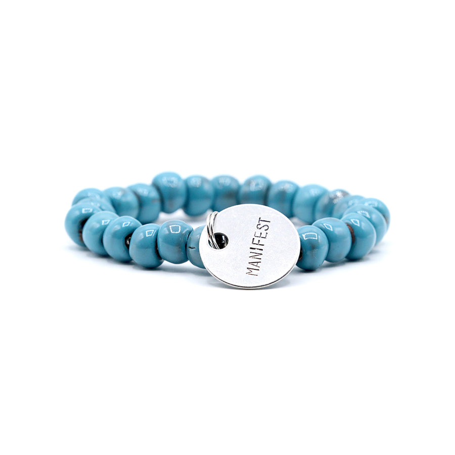 Womens beaded charm bracelet made with clay beads.